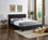 Lit en PU noir avec tête de lit rembourrée Comprend un support de matelas